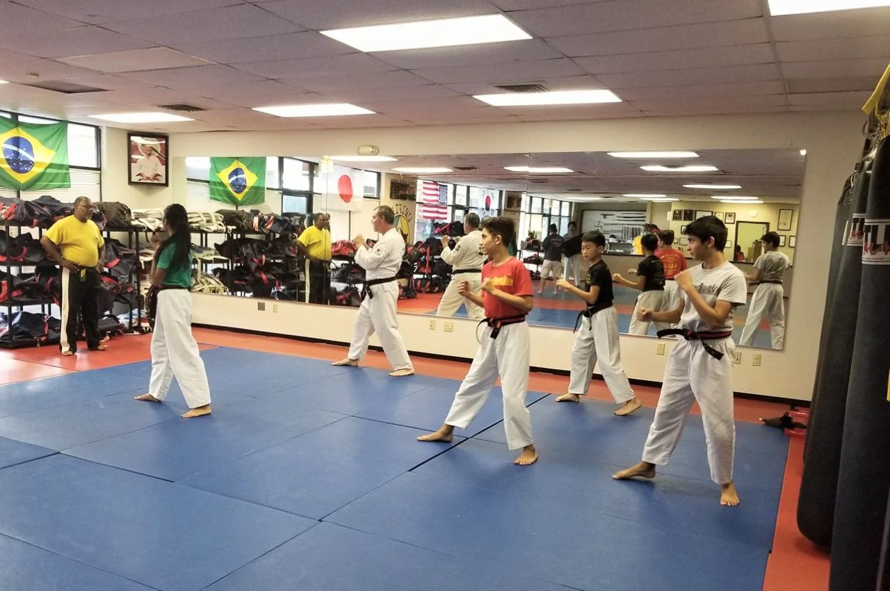 Adults relieving stress through martial arts
