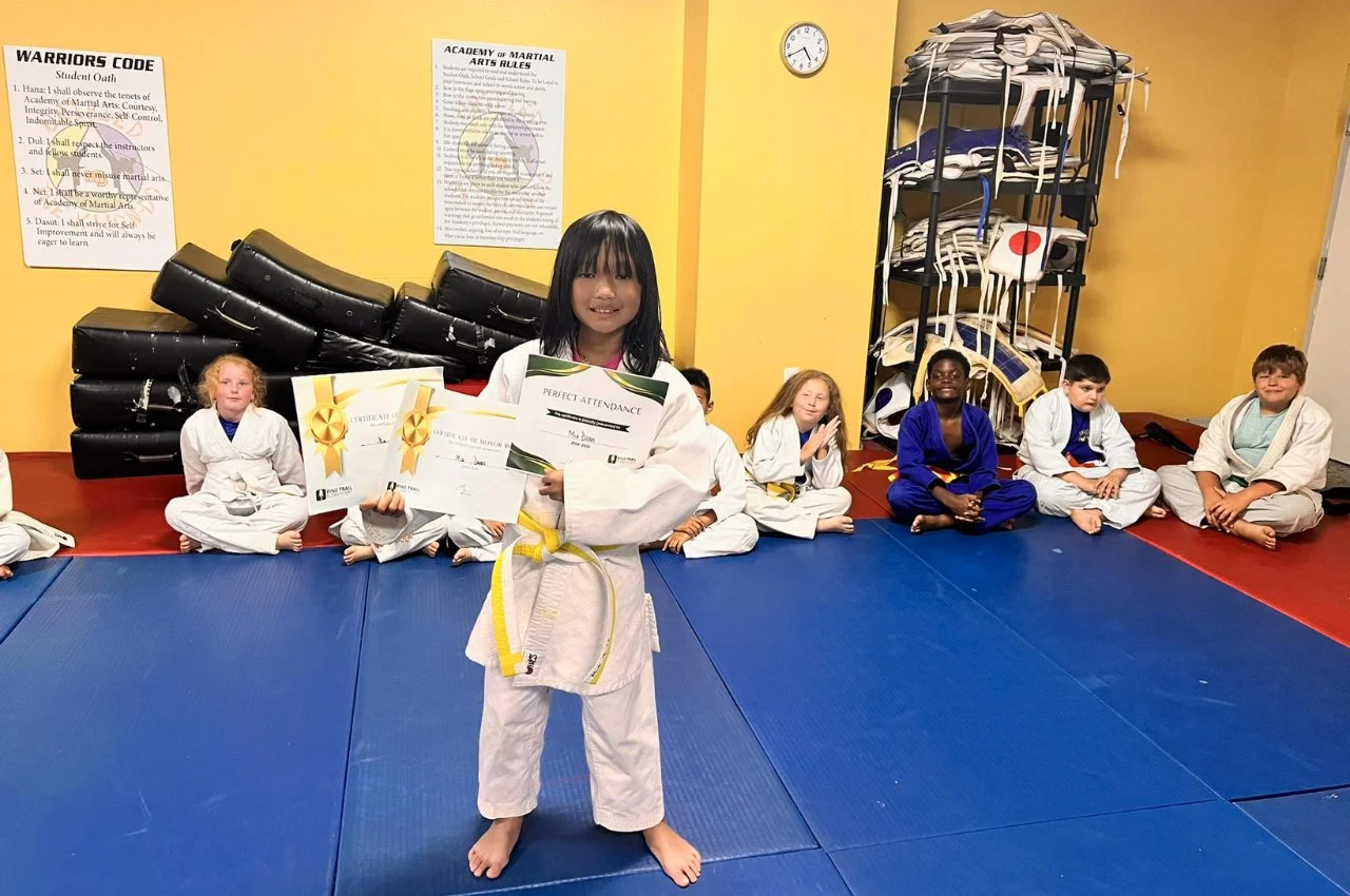 Kids learning sportsmanship through martial arts